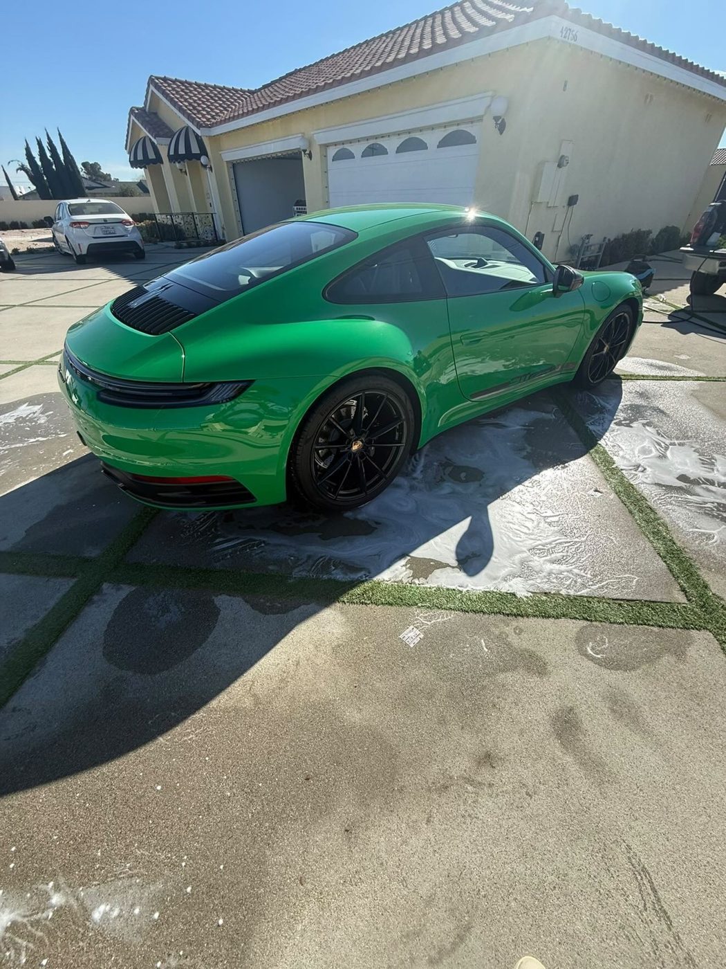 Green sport coupe with a high-gloss exterior detail