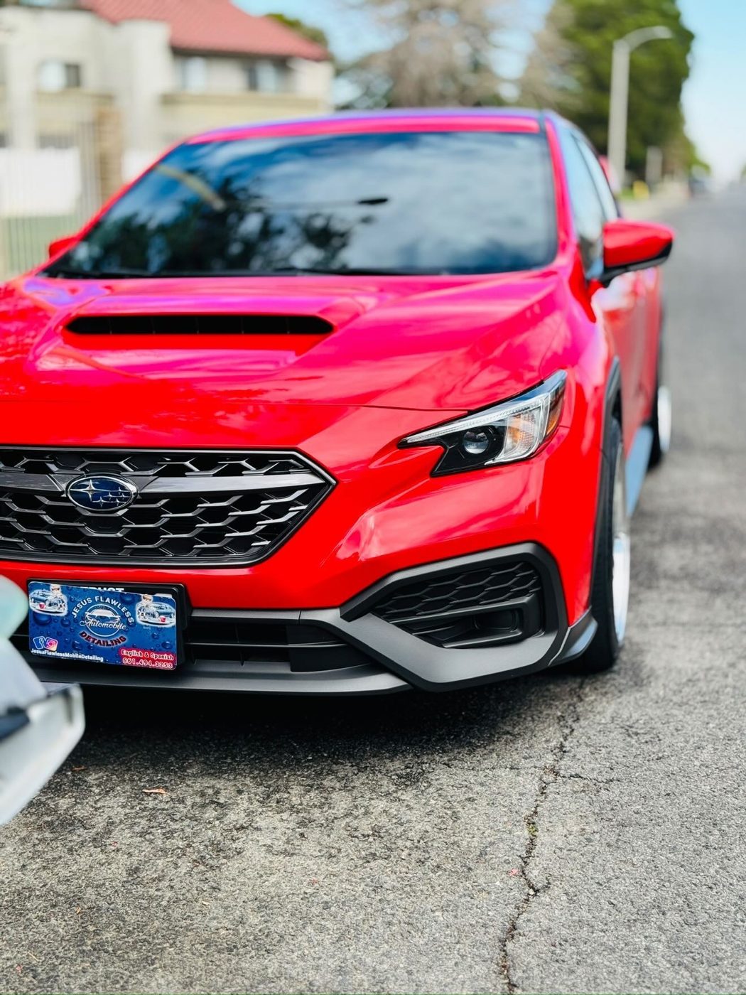 Kia K5 GT front end with a deep, wet red shine