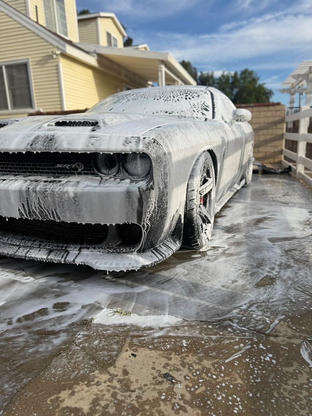 Snow-foam pre-wash coating the paint during a hand wash