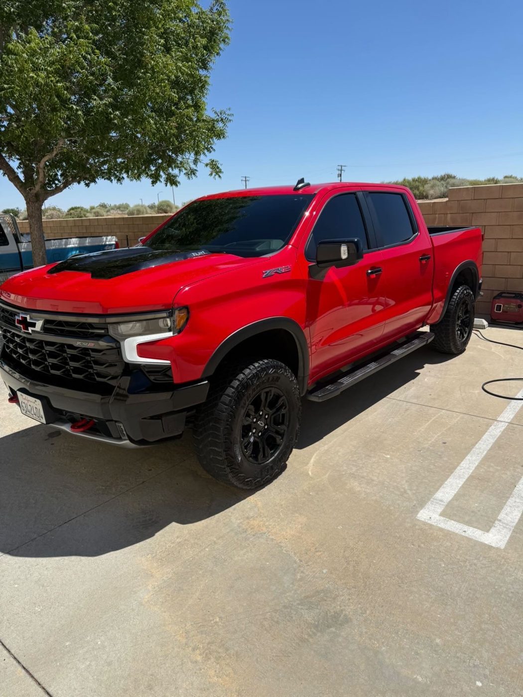 Lifted red pickup truck detailed inside and out